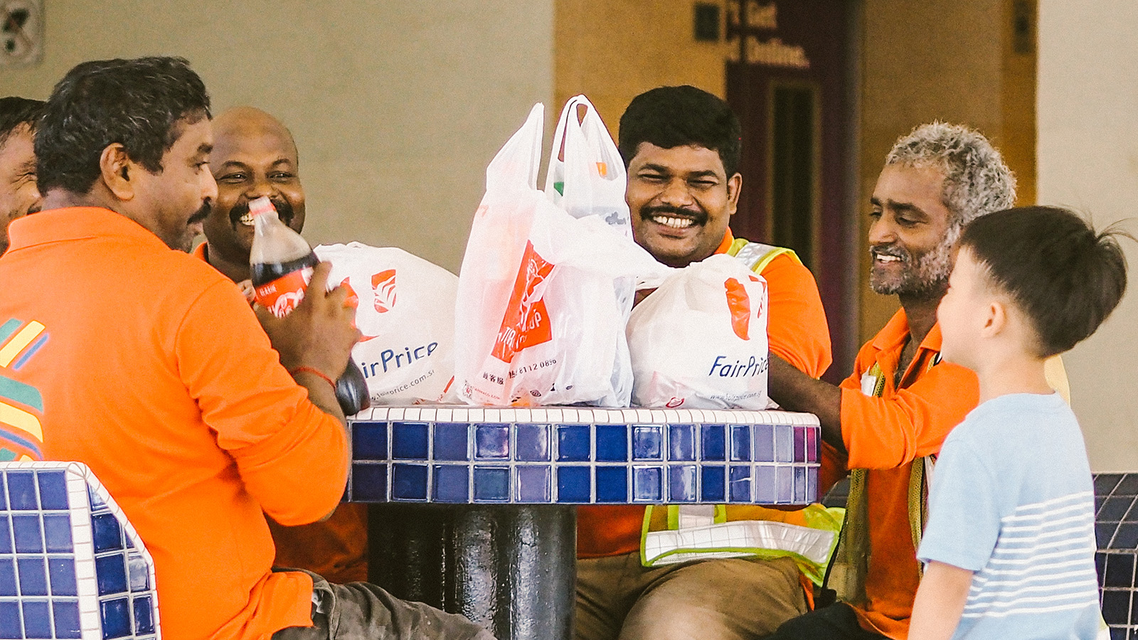 singaporekindnessmovement_thepride_featured_migrant_workers_happily_eating.jpg